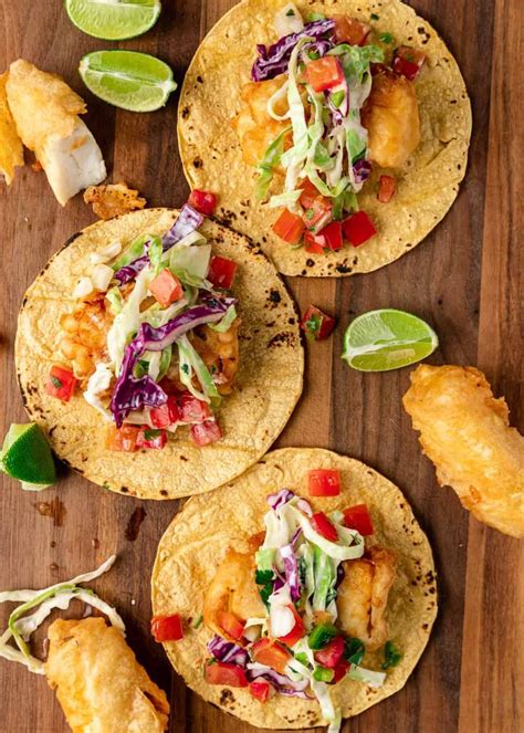 These battered fish tacos combine Baja style fried fish, crunchy purple cabbage slaw, and a ...