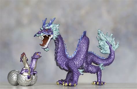 Purple Dragon Figurine Protecting Its Hatching Chicks Stock Photo - Image of tail, protecting ...