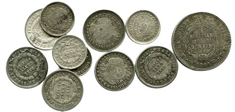 Lot of 11 Bolivian small silver coins: one 1/5 boliviano (1864FP, 9 widely spaced stars); six 10 ...