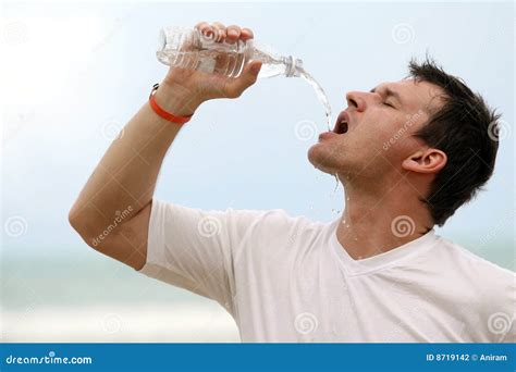 Man Drinking Water from Bottle Stock Photo - Image of vacation, beach ...