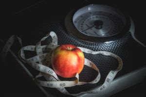 Weight Loss Concept. Weight Scale,Tape Measure, and Apple