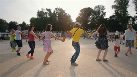 People Dancing In Circle Holding Hands Stock Footage SBV-309278044 - Storyblocks