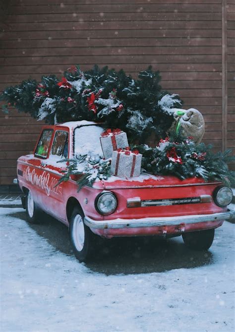 Christmas Tree on a Vintage Car · Free Stock Photo