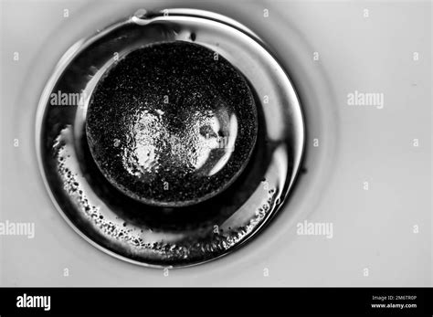 Selective focus on an open bronze sink drain Stock Photo - Alamy