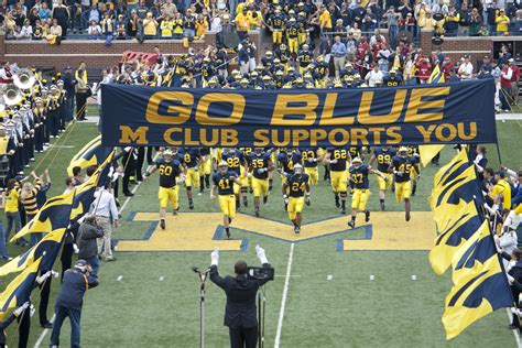 File:20090926 Michigan Wolverines football team enters the field with marching band salute.jpg ...