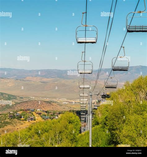 Square Park City Utah mountain with chairlifts and hiking trails view at off season Stock Photo ...