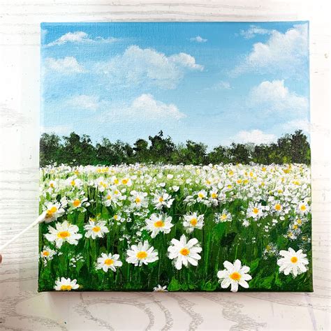 A painting of white daisy field with blue sky and fluffy clouds on green landscape Acrylic ...