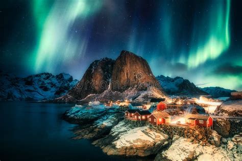 Aurora Borealis, Northern Lights Above on Snowy Mountain in Skagsanden Beach at Lofoten Islands ...