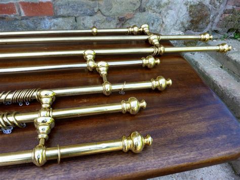 A Set Of 7 Chunky Antique Style Brass Curtain Poles With Fittings | 348252 | www.elmgarden.co.uk