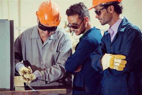 Premium Photo | Workers in industrial factory