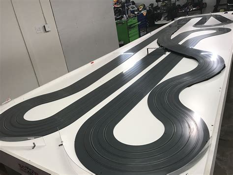 MRC, custom 4 lane HO 1/64 Viper track, each lane is over 100 feet long, this track sits on a 25 ...