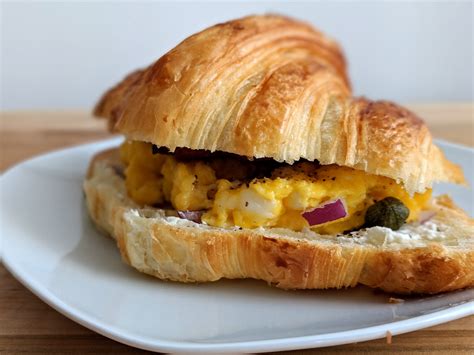 Croissant breakfast sandwich with bacon and eggs – Bite Sip Savour : Bite Sip Savour