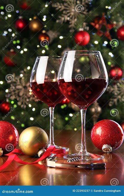 Glasses Of Red Wine In Front Of Christmas Tree Stock Image - Image: 22393237