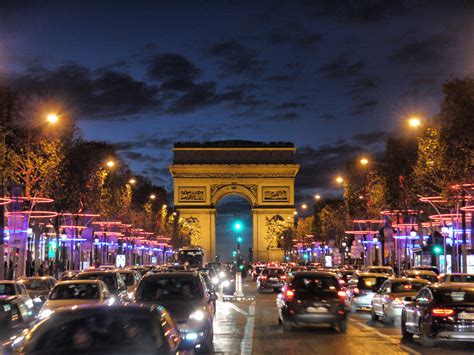 An Evening on Champs-Élysées: Arc de Triomphe at Dusk, Paris, France | Go To Travel Guides