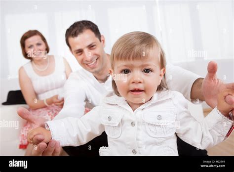 Proud parents with their baby Stock Photo - Alamy