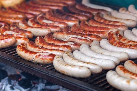 Bratwurst on a large grill stock photo. Image of brat - 71965580