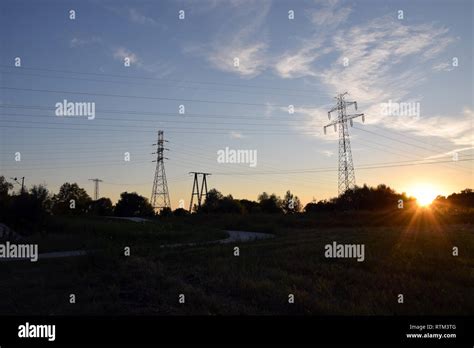 Electric poles on sunset Stock Photo - Alamy