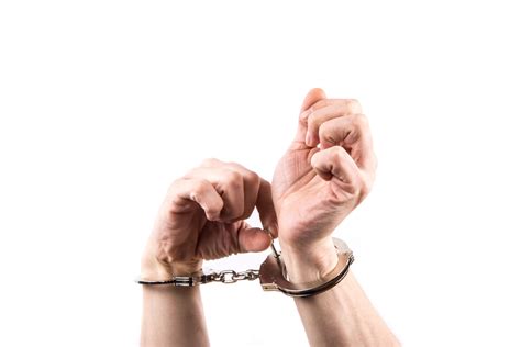 Hands In Handcuffs Free Stock Photo - Public Domain Pictures
