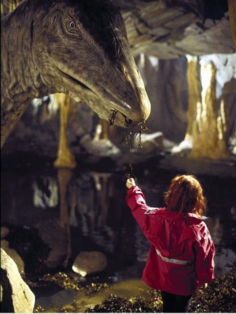 Live-action movie where a brontosaurus-like dinosaur is hurt in a cave ...