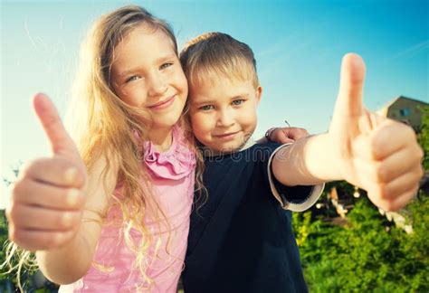 Happy kids outdoors stock image. Image of cheerful, beauty - 70367053