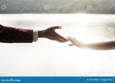 Man and Woman Holding Hands at Sunset Stock Image - Image of team ...