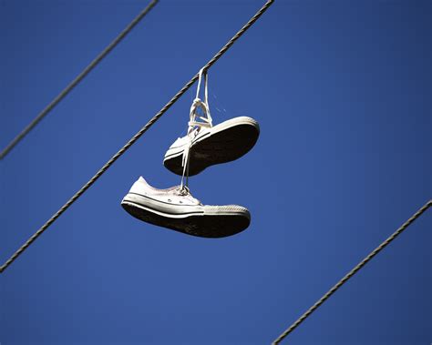 Shoes Tied on Power Lines: A Symbol of Urban Culture and Mystery – shoes