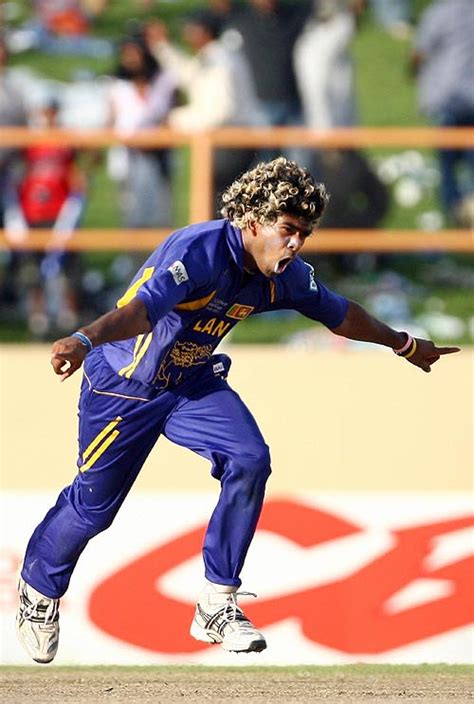 Lasith Malinga enjoys the moment after taking four wickets with ...