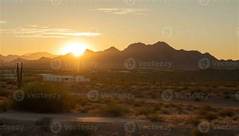 Silhouette of mountain range back lit by sunset golden sunlight ...