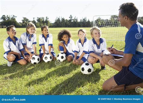 Group of Children in Soccer Team Having Training with Coach Stock Image - Image of african ...