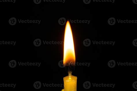 Candle flame close on black background 13426481 Stock Photo at Vecteezy