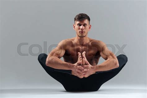 Handsome man doing yoga pose | Stock image | Colourbox