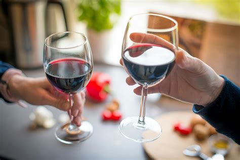 Close-up Photo of Two People Toasting With Red Wine · Free Stock Photo