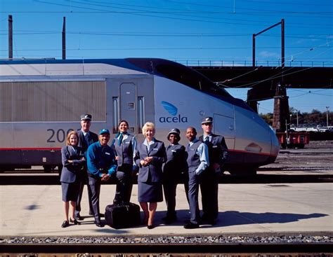 Amtrak employees show off their new uniforms in front of the brand new ...