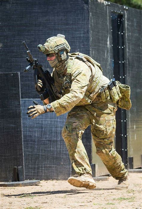 an Australian infantry soldier from 3 Brigade engaged in live fire training in an urban ...