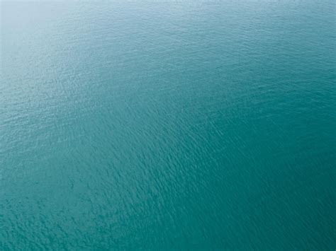 Premium Photo | Sea surface aerial view,Bird eye view photo of small waves and water surface ...