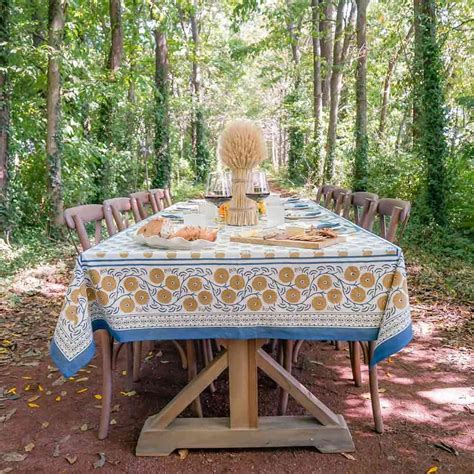 Outdoor dinner table in the woods with Gaya Teal & Marigold tablecloth ...