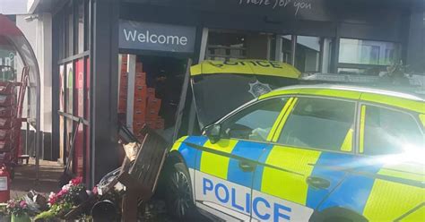 Watch as PSNI car crashes into Spar shop in Lisburn - Belfast Live