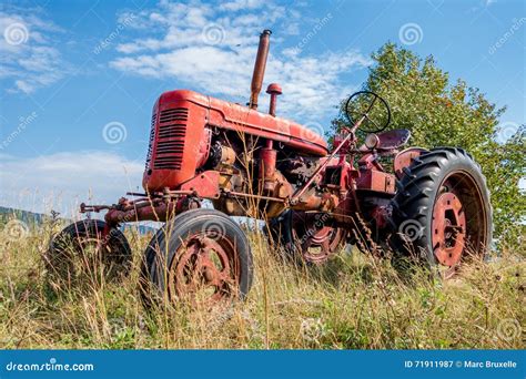 Red old rusty tractor stock image. Image of tractors - 71911987