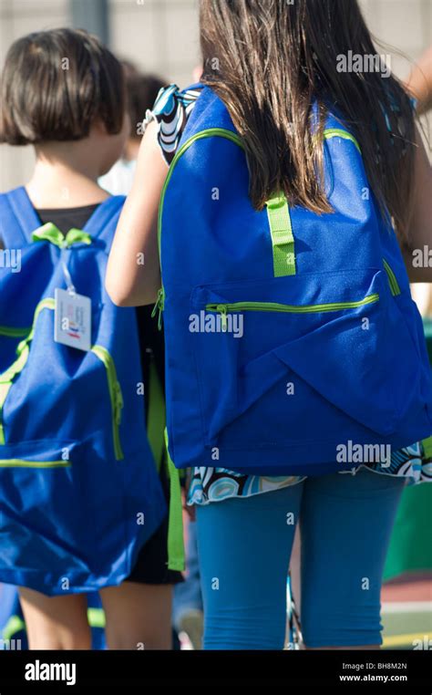 Elementary school students at a Massachusetts public school receives supplies (new backpacks ...