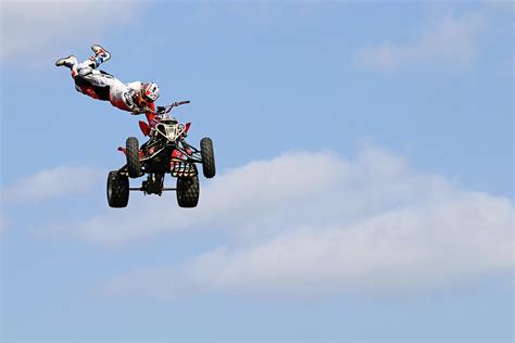 Quad Stunts- In The Air III Photograph by Debbie Oppermann - Fine Art America