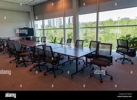 messy office meeting room unorganized chairs Stock Photo - Alamy