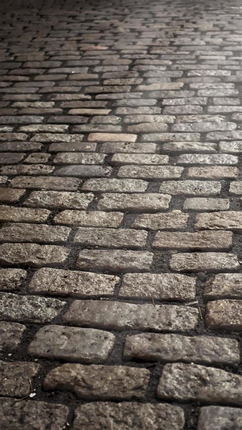 Cobblestone road at night 2029408 Stock Photo at Vecteezy