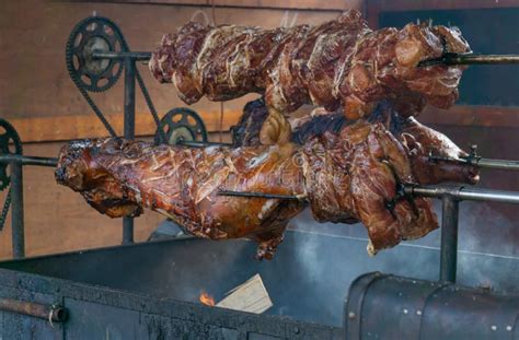 Whole Pig on the Rotisserie Being Cooked Stock Photo - Image of plate, tasty: 200272576