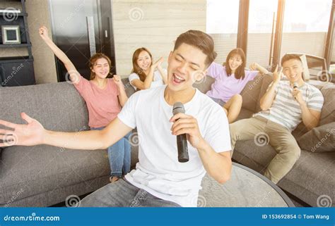 Group of Friends Playing Karaoke at Home Stock Photo - Image of laughing, indoors: 153692854