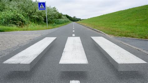 This '3D' Crosswalk Uses an Optical Illusion to Slow Drivers | Mental Floss