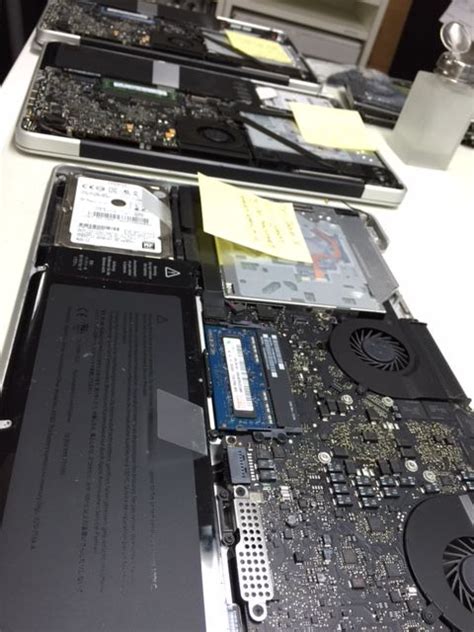 there are many pieces of electronic equipment on the counter top that is being removed from the ...