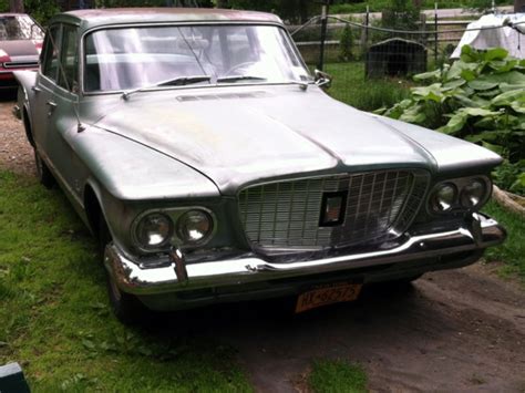 1960 Plymouth Valiant at Harrisburg 2014 as T119 - Mecum Auctions