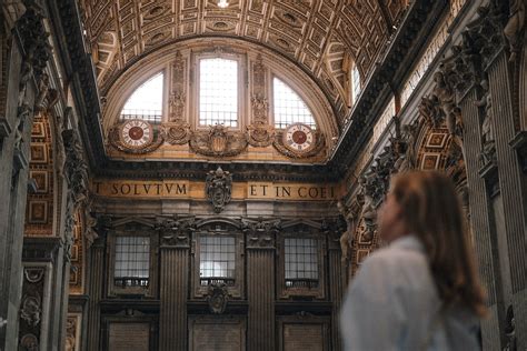 Tourist Admiring the Ornately Decorated Interior of St. Peters Basilica ...