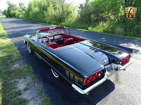 A Raven Black 1960 T-Bird convertible with red leather interior | American dream cars, Classic ...