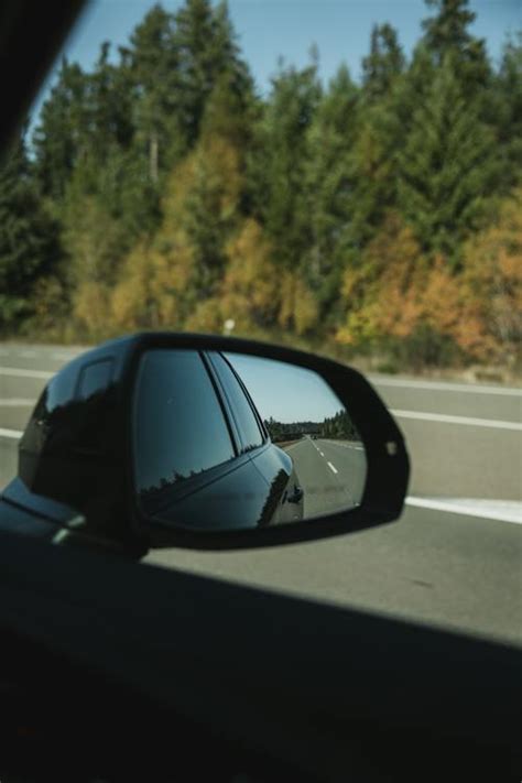 Reflection of Car and Road in Side Mirror · Free Stock Photo